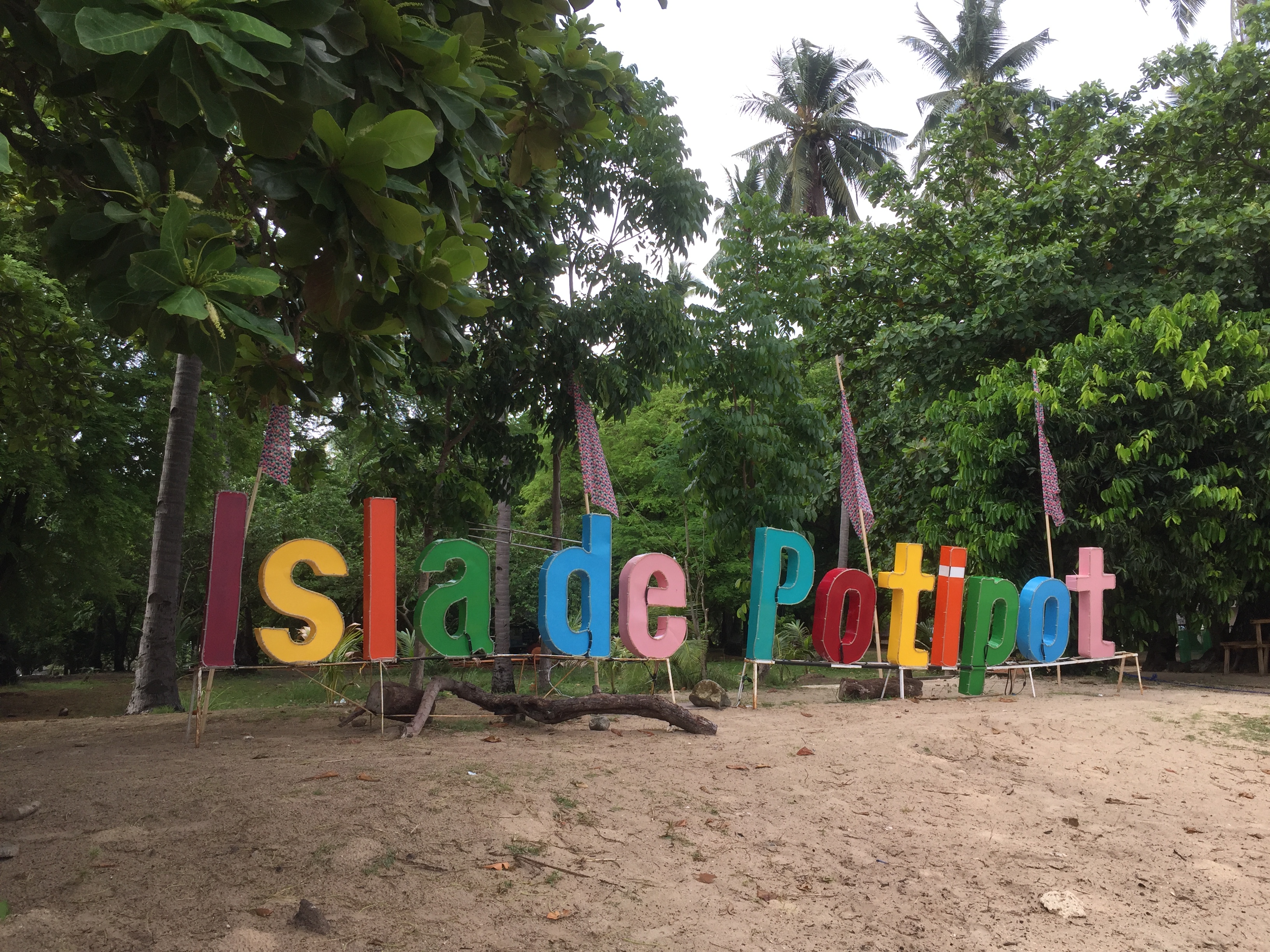 best beaches near manila welcome sign at potipot island