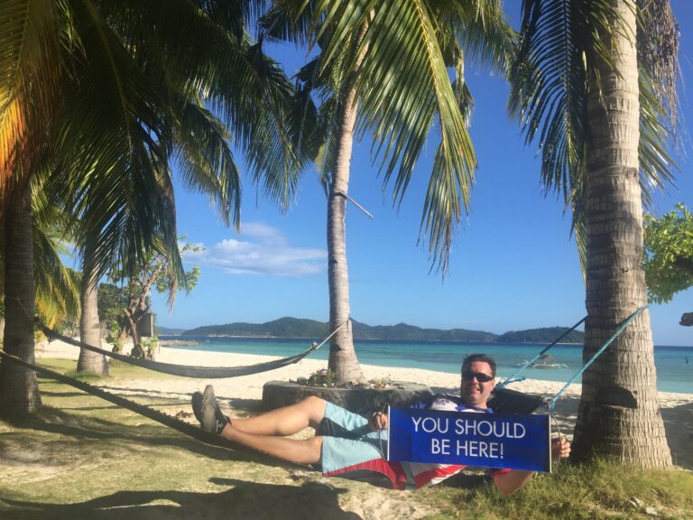 Relaxing in hammock at Malcapuya Island