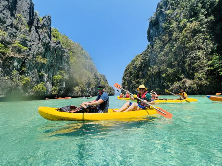 Dezza kayaking with his nephew in Big Lagoon, Miniloc Island, El Nido