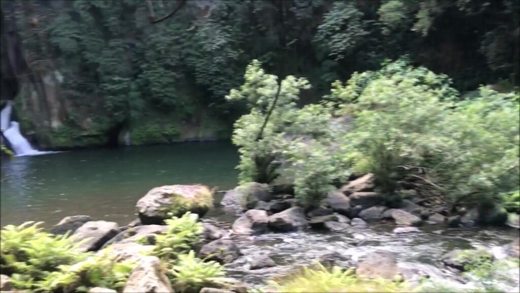 Green pool in the rocky gorge below Malibiclibic Falls, Cavite