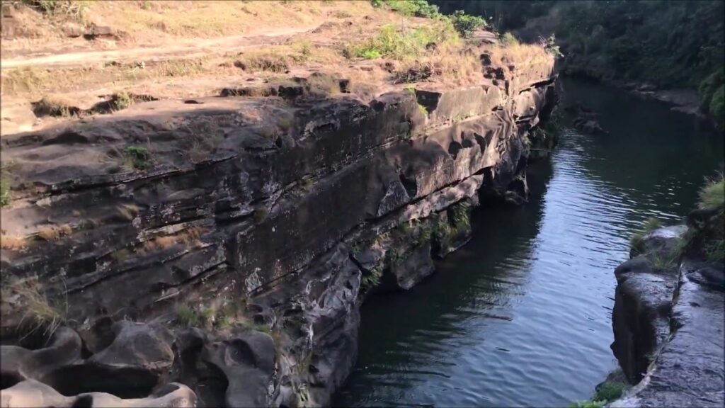 Pitted rock ledge above the canyon pool at Pantihan Falls, Maragondon, Cavite