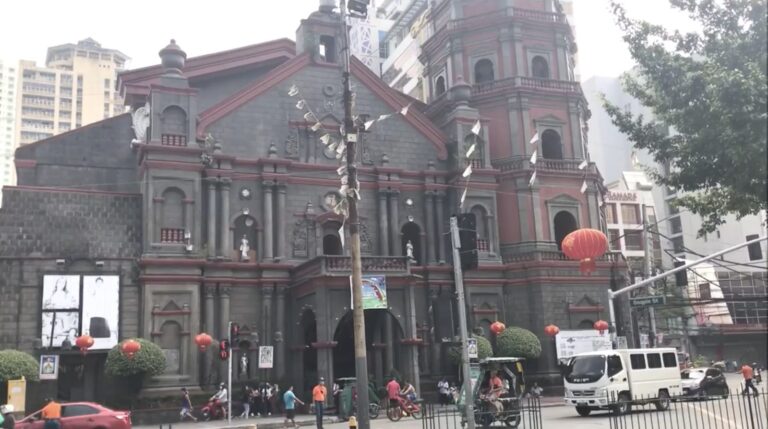 Binondo Church with red lanterns on a street corner in Manila