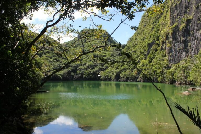 Calm green Tayak Lagoon surrounded by limestone cliffs in Caramoan, Camarines Sur