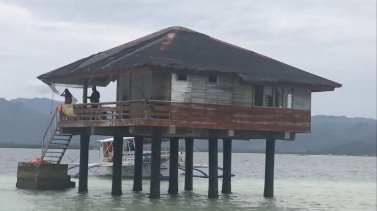 Close view of a stilt cottage at Manjuyod Sandbar at high tide