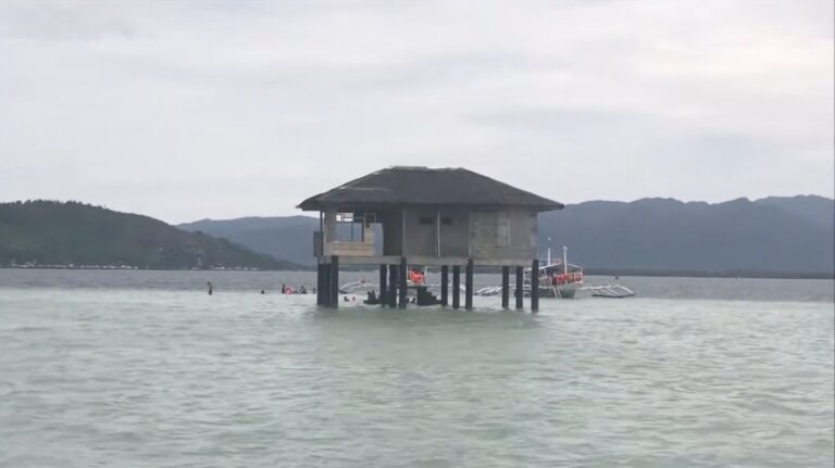 Stilt cottage at Manjuyod Sandbar at high tide, Negros Oriental