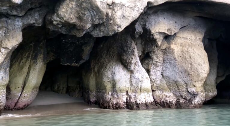 Sea cave entrance with a sandy floor at Ramos Caves near Nasugbu, Batangas