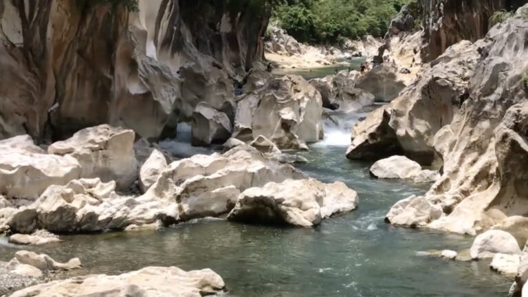 Rocky pools and rapids between limestone walls along Tinipak River in Rizal